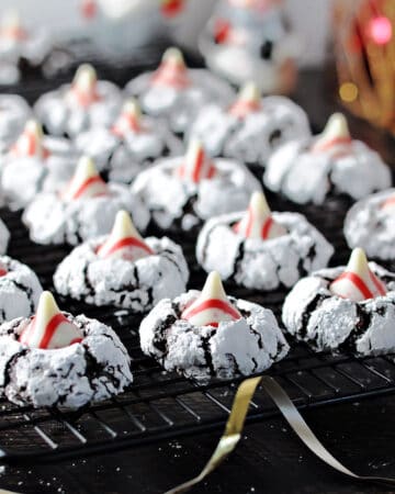 chocolate peppermint kiss cookies cooling on a rack