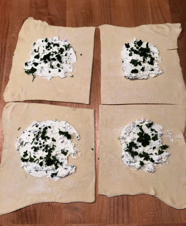 cream cheese and parsley added to each pastry square