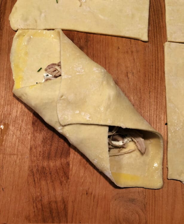 pastry corners being folded in toward the center
