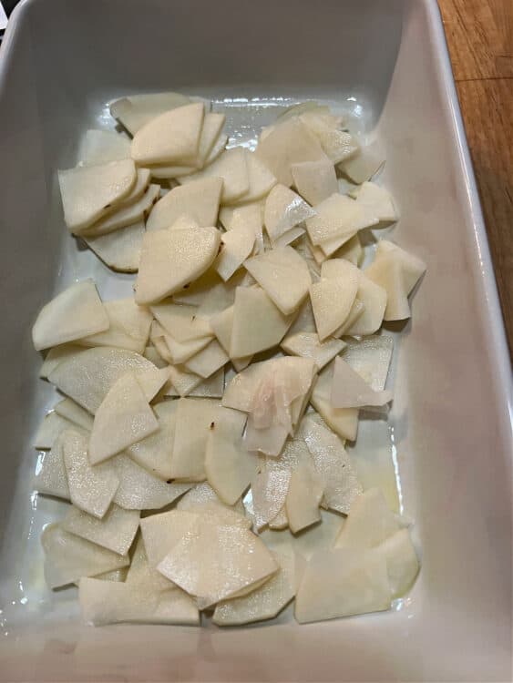 potato slices in baking dish