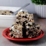 Oreo or cookies and cream rice krispies on a red plate.