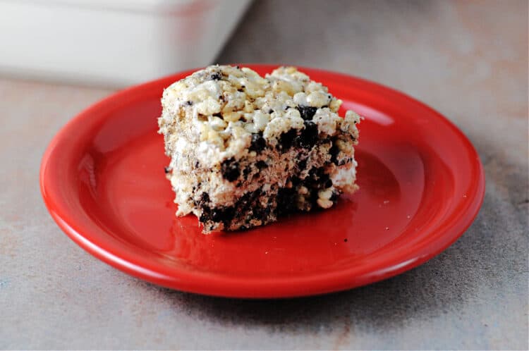 a square of oreo krispies on a red plate.