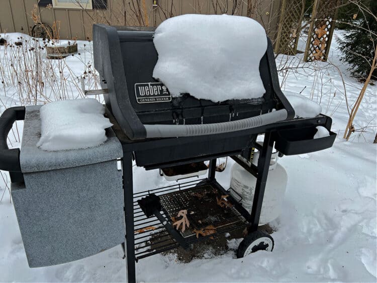 snow covered bbq grill.