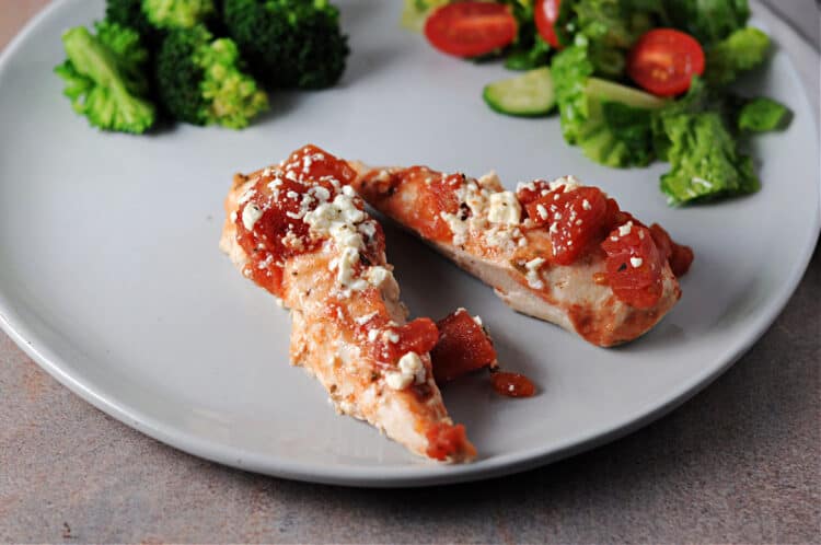 2 baked feta chicken tenders on a plate