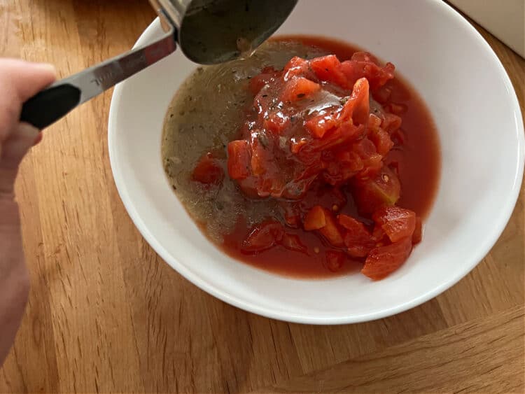 tomatoes and dressing in a bowl