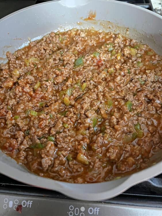 sloppy joe mix simmering in a skillet