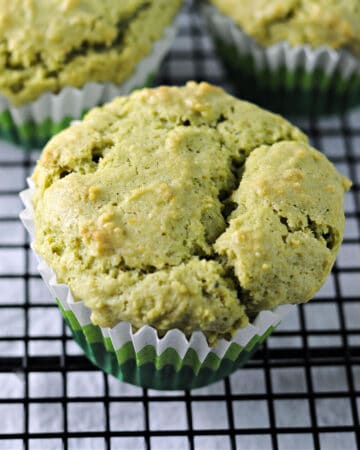 matcha green tea muffin on a wire rack