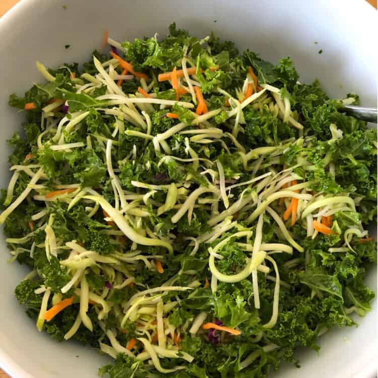 broccoli kale salad with cranberries in a serving bowl