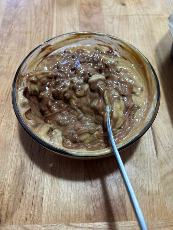 partially melted chocolate chips mixing with peanut butter