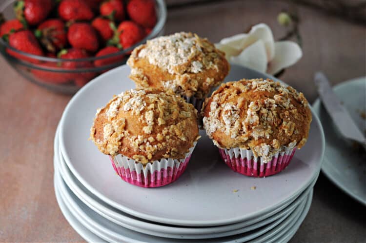 3 strawberry muffins on a plate.
