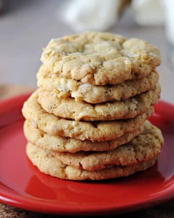 stack of oatmeal coconut cookies on a small red plate.