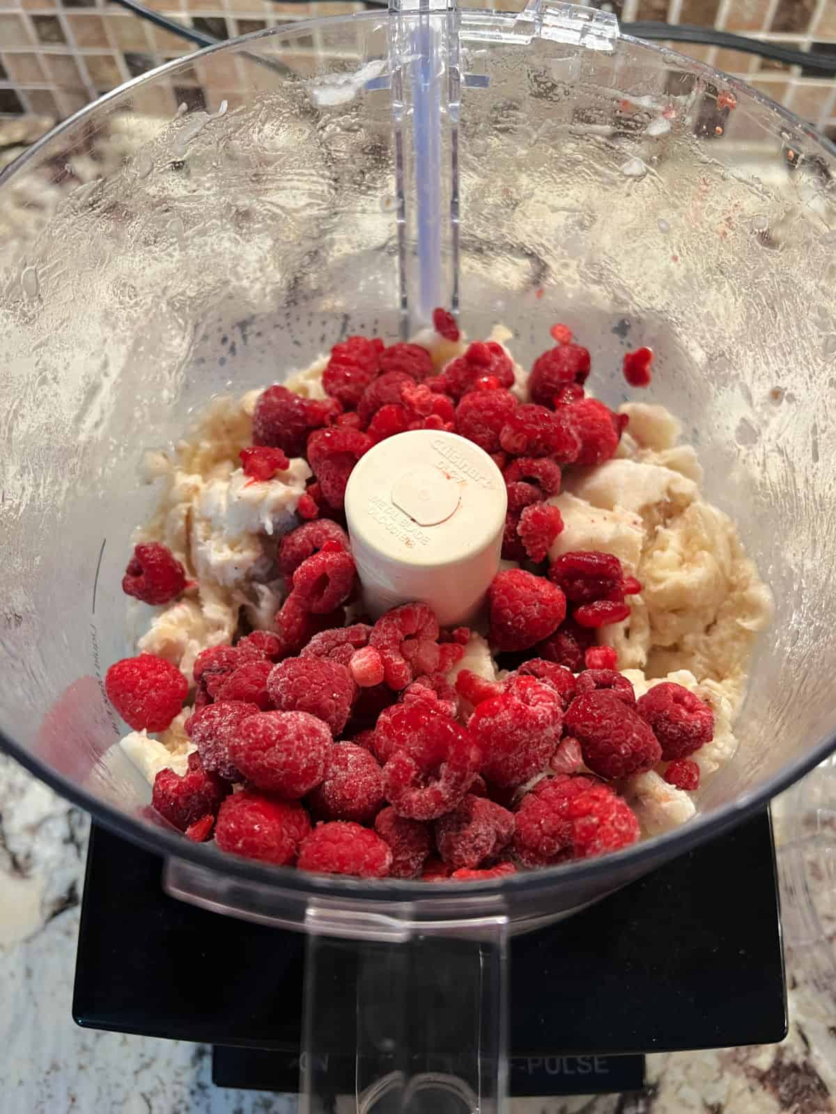 raspberries added to food processor.