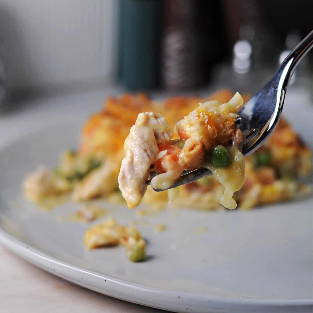 a forkful of chicken hash brown casserole.