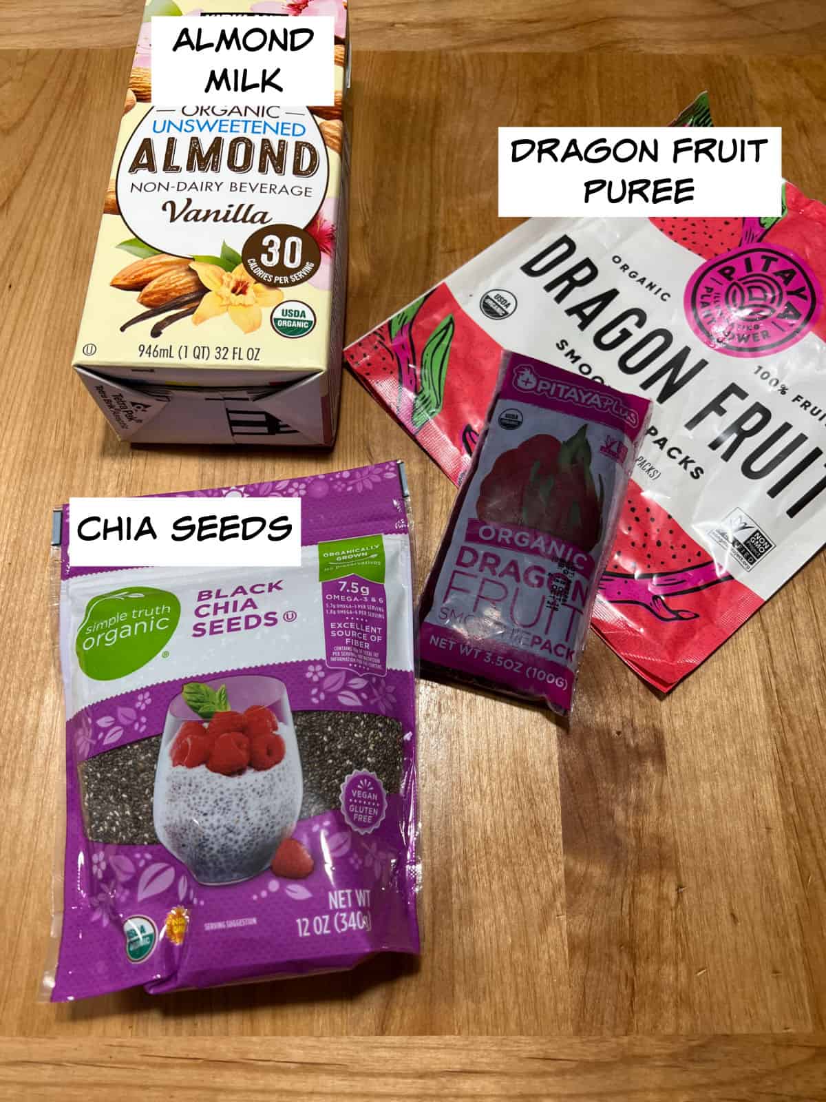 ingredients: almond milk, pitaya smoothie packs, and black chia seeds.