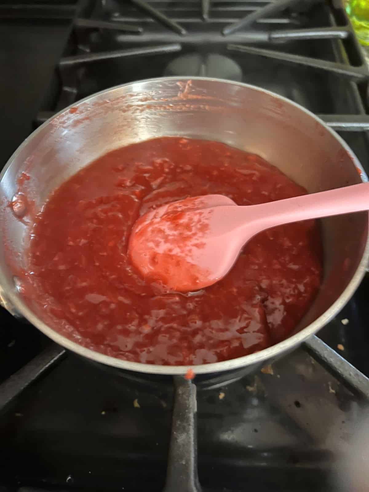 strawberry filling cooking in the pan.