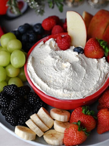 Cool Whip dip surrounded by dippable fruit.
