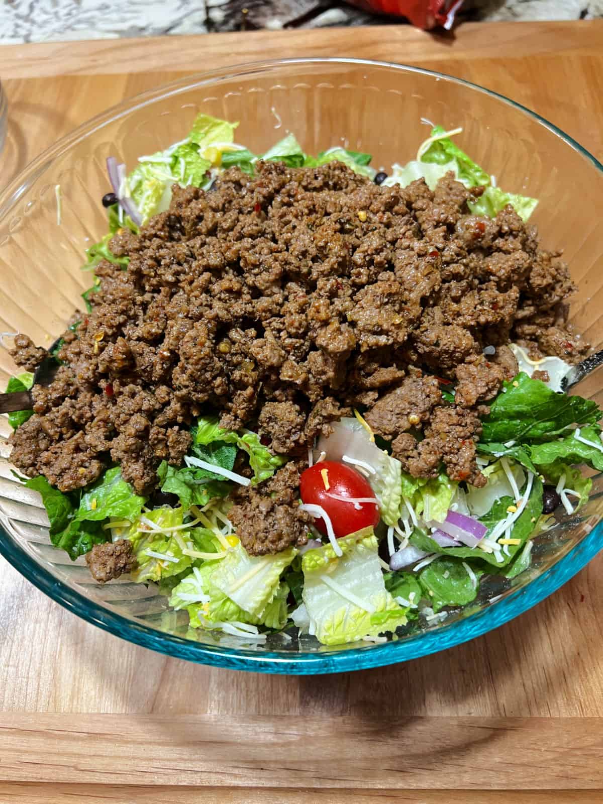taco meat added to the bowl.