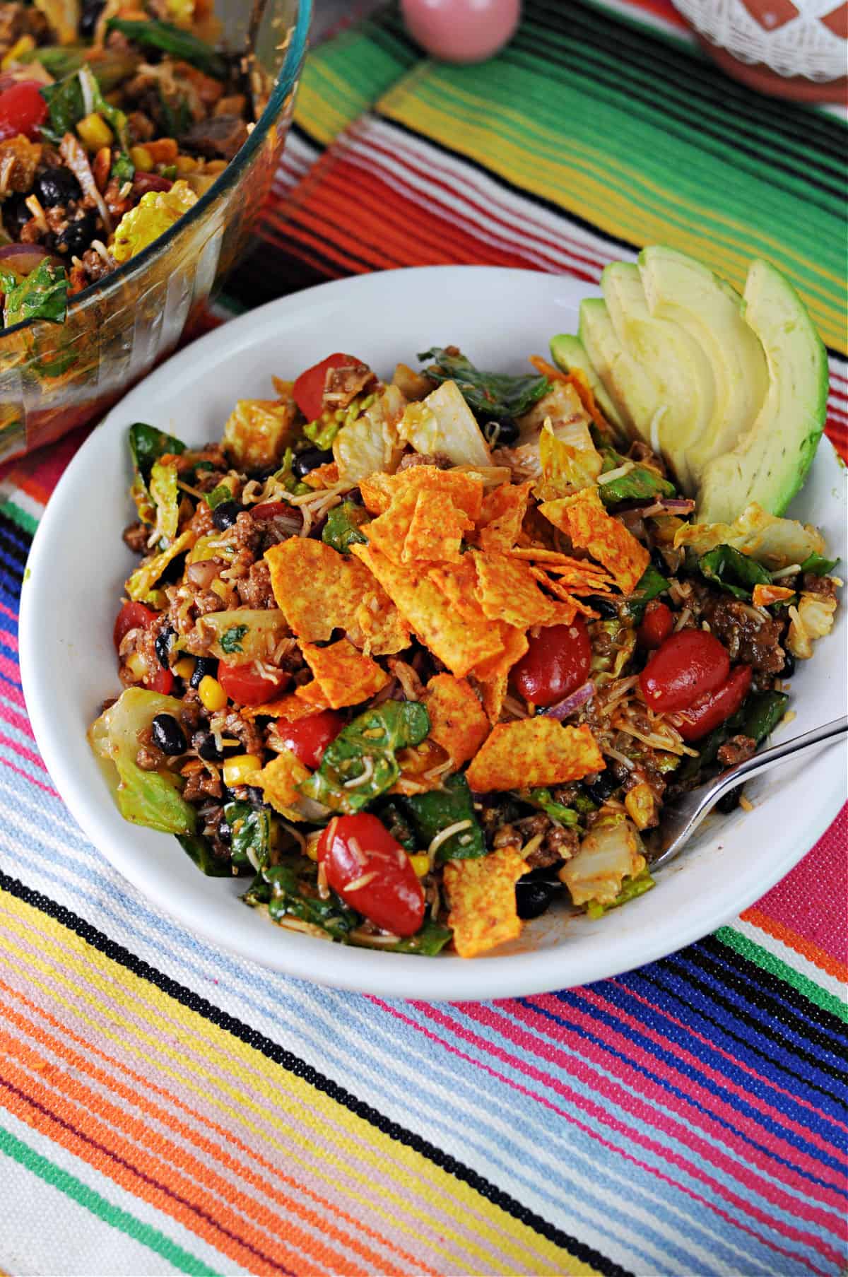 meal sized bowl of taco salad topped with doritos.