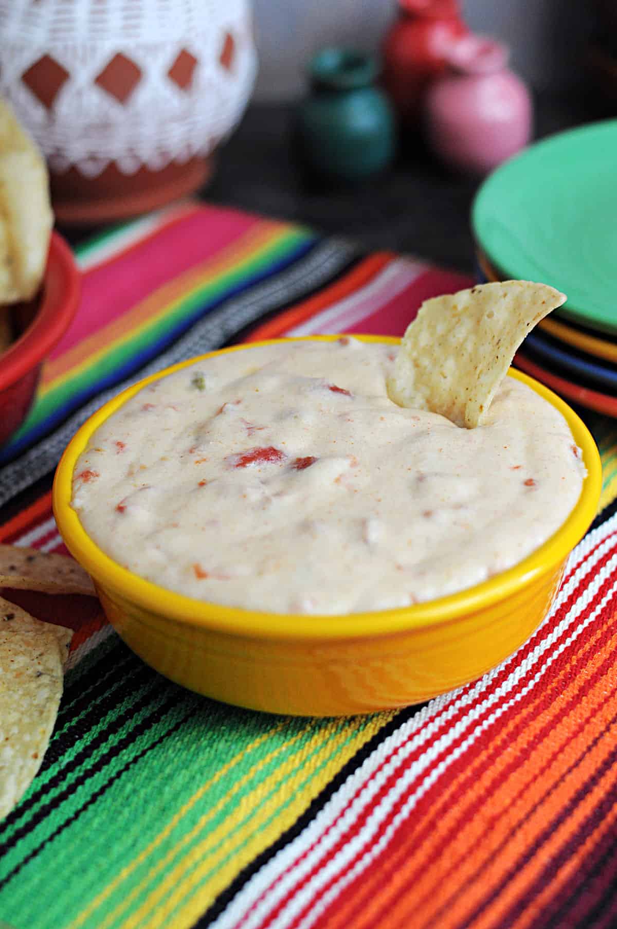 bowl of Monterey Jack queso served with chips.