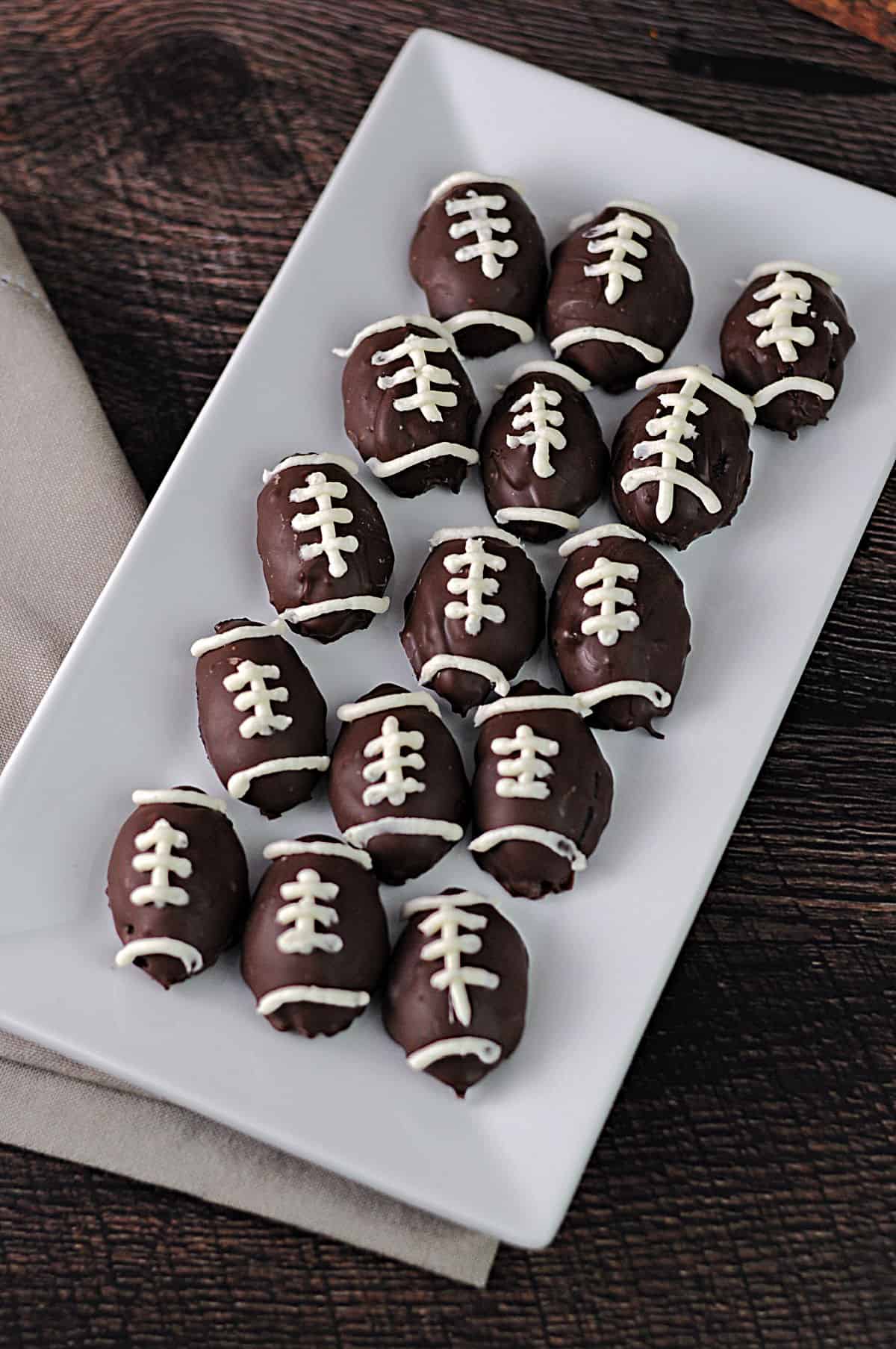 serving  tray of football shaped Oreo truffles.