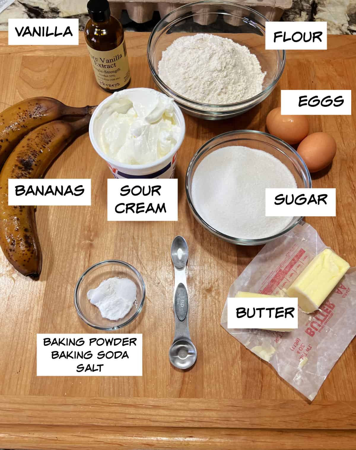 ingredients: vanilla, flour, eggs, sugar, sour cream, bananas, butter, baking powder, baking soda, and salt.