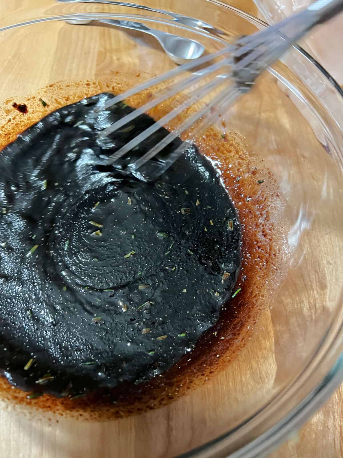 marinade ingredients whisking in a bowl.