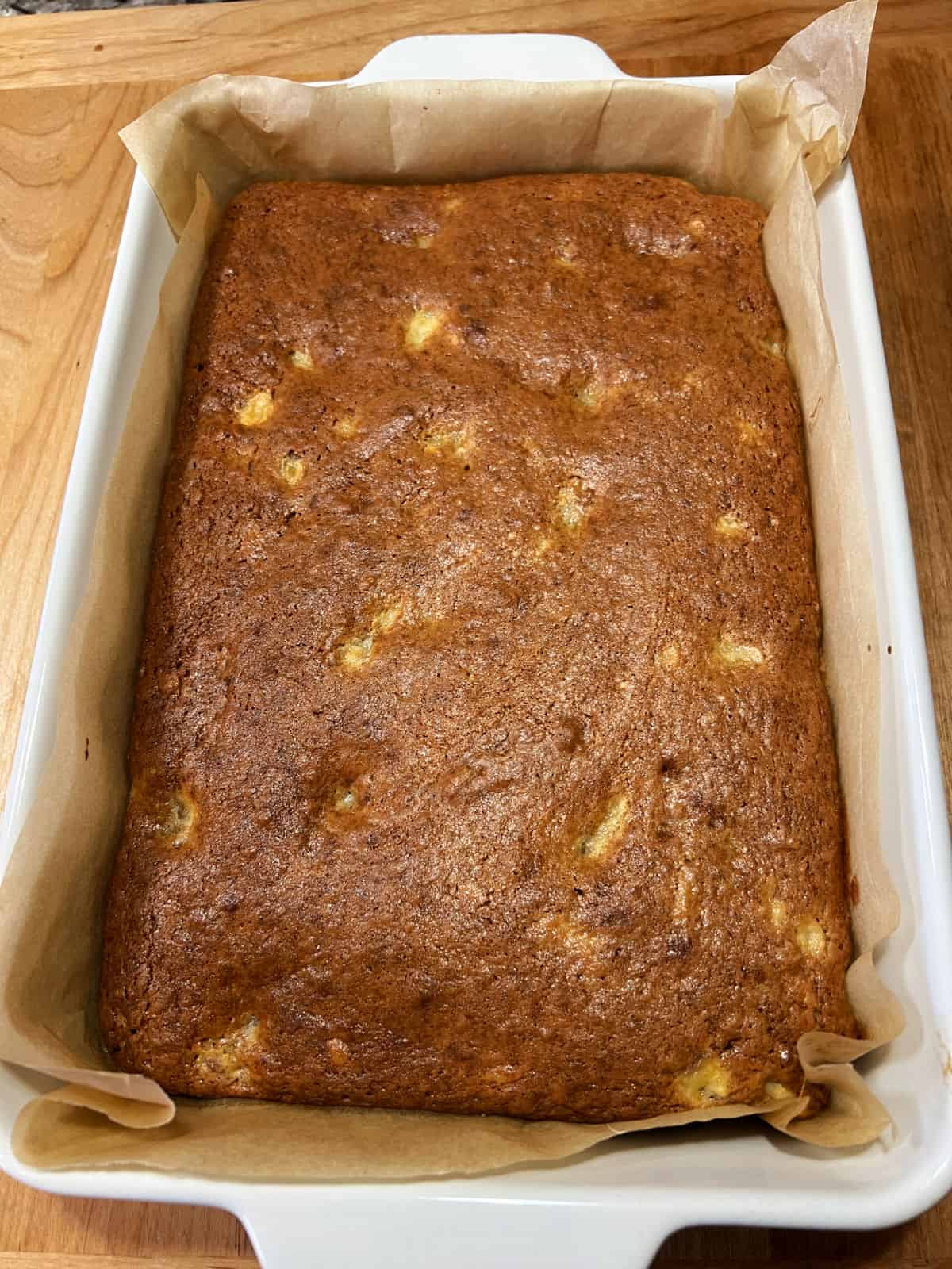 9x13 pan of banana bread ready to be cut.