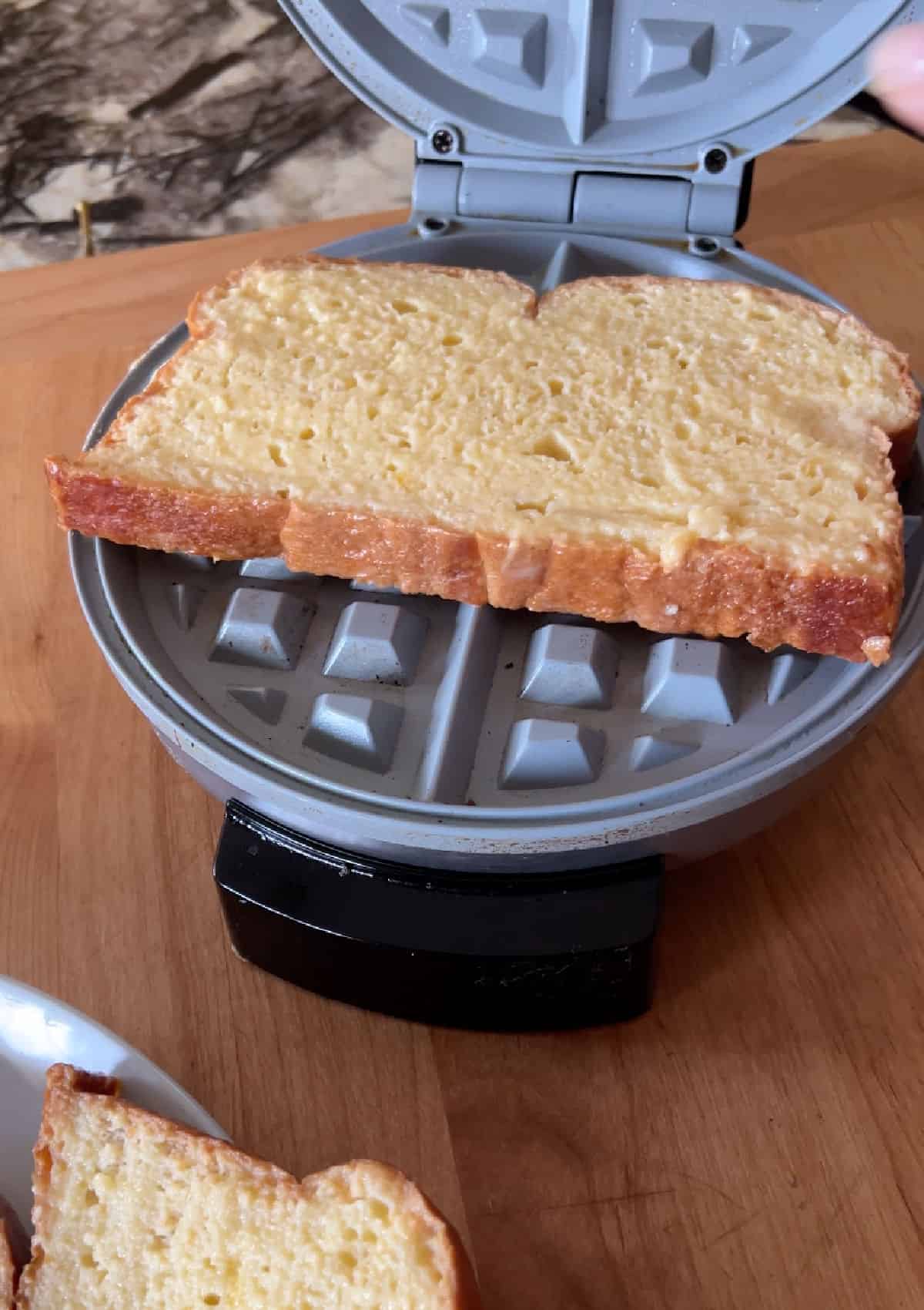 soaked bread placed in the waffle maker.