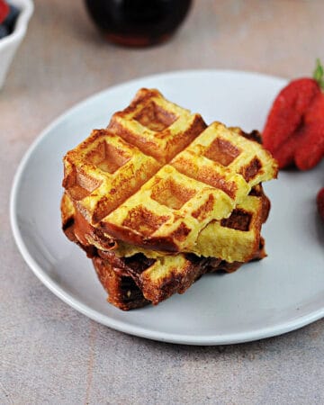 waffle iron french toast on a plate ready to eat.