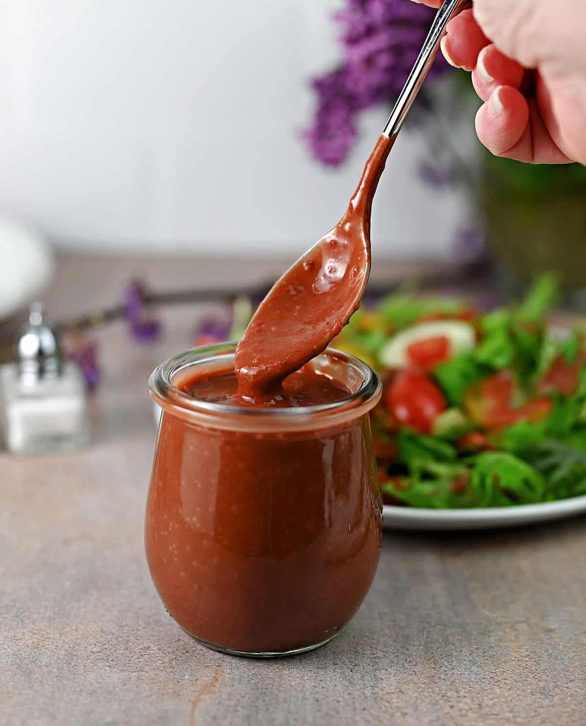 Jar of strawberry vinaigrette dressing ready to use.