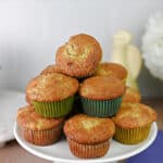 stack of banana bread muffins on a serving plate.