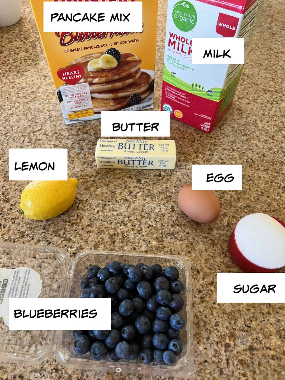 ingredients: pancake mix, milk, butter, lemon, egg, sugar, and blueberries.