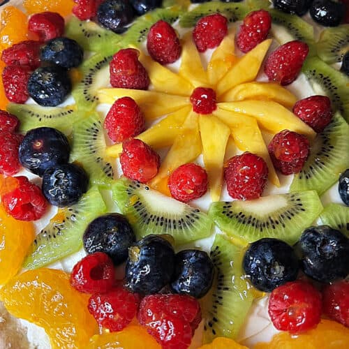 Close up image of a fruit pizza.