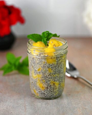 Mango chia seed pudding in a small jar.