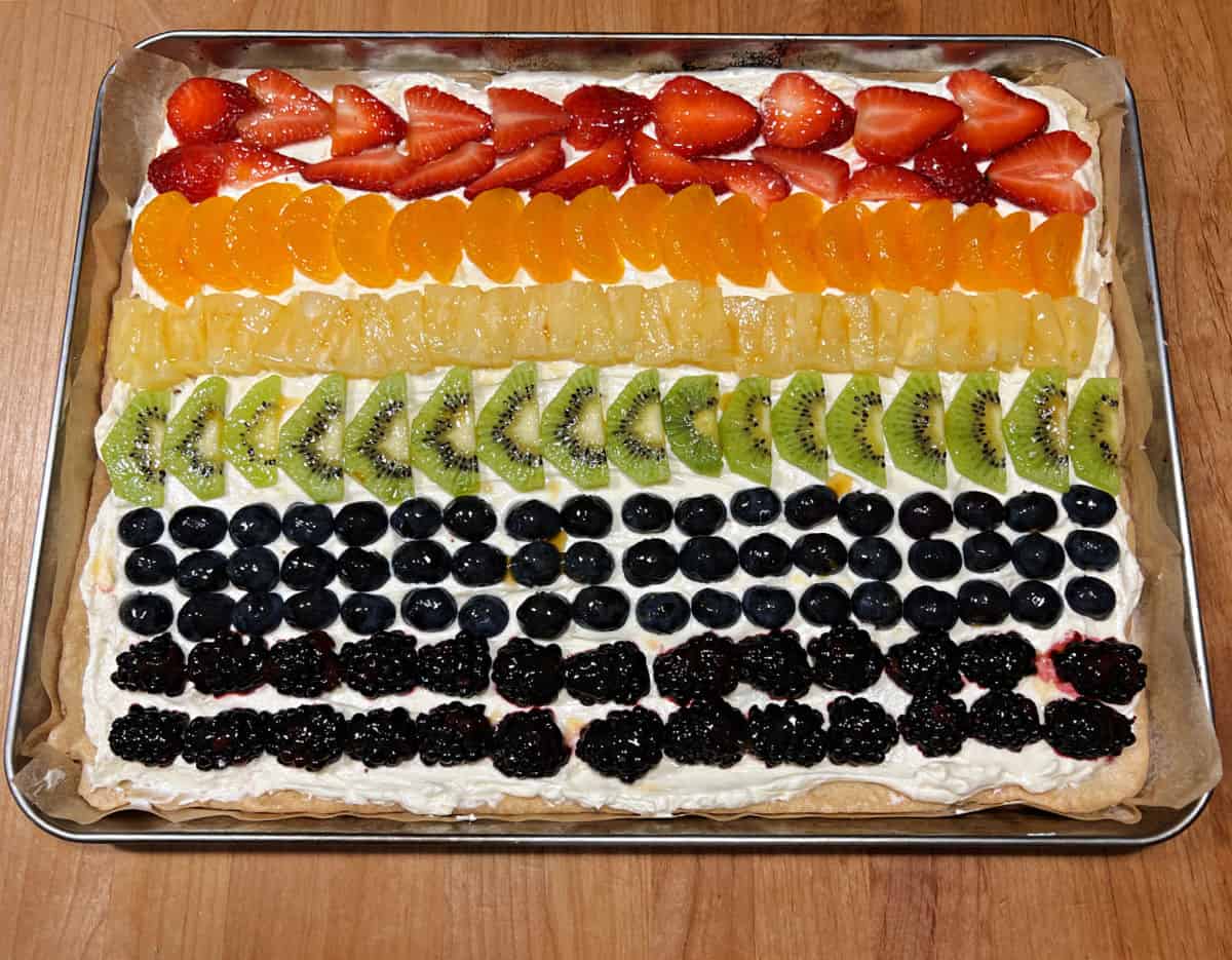 Fruit pizza decorated to resemble the Pride flag.