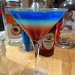 Rainbow martini showing bright colored layers.