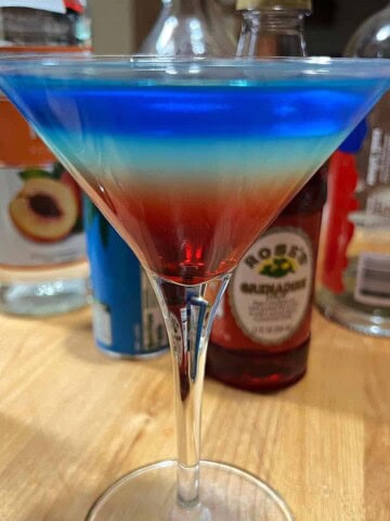 Rainbow martini showing bright colored layers.