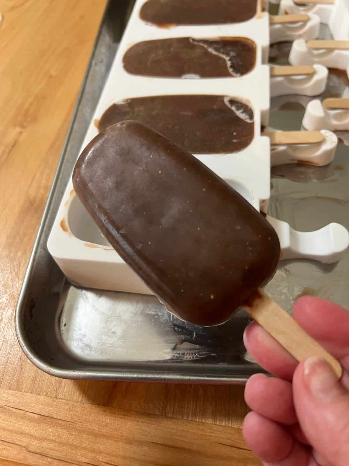 Homemade fudgesicle removed from the silicone mold.