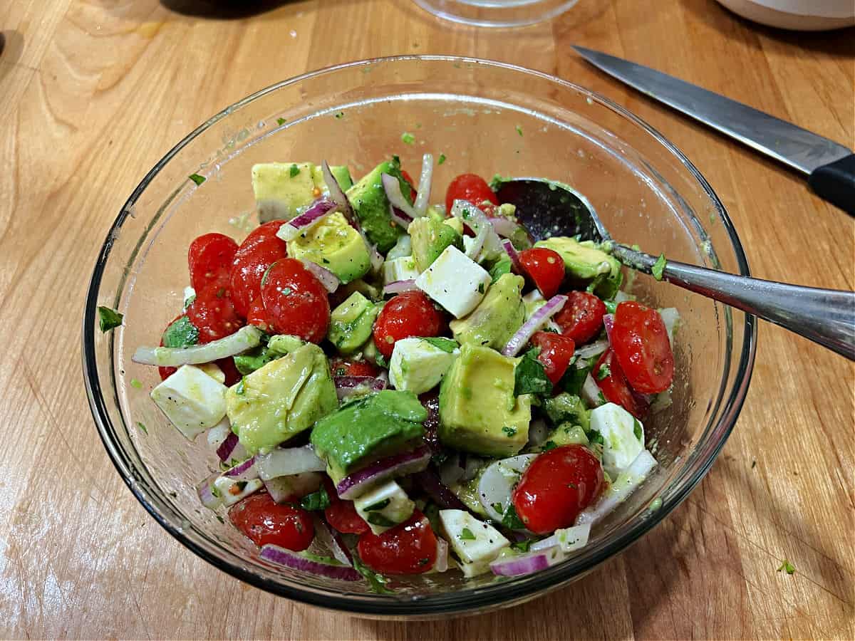 All ingredients tossed together to make Mexican Avocado Salad.