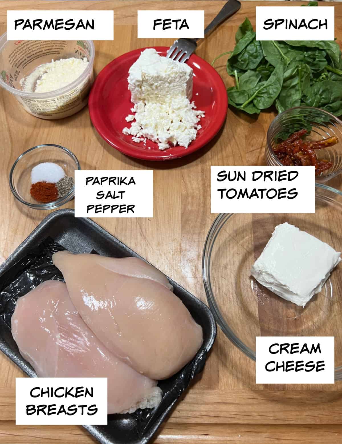 Ingredients: parmesan, feta, spinach, sun dried tomatoes, cream cheese, chicken breasts, paprika, salt, and pepper.