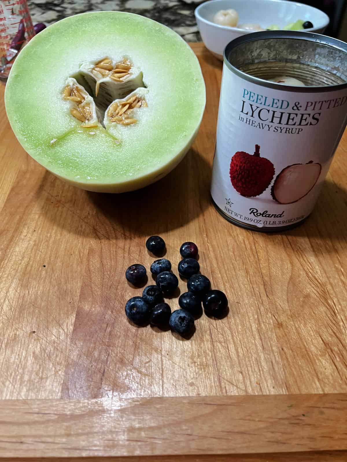 ingredients needed for the eyeballs: honeydew melon, lychee fruit, and blueberries.