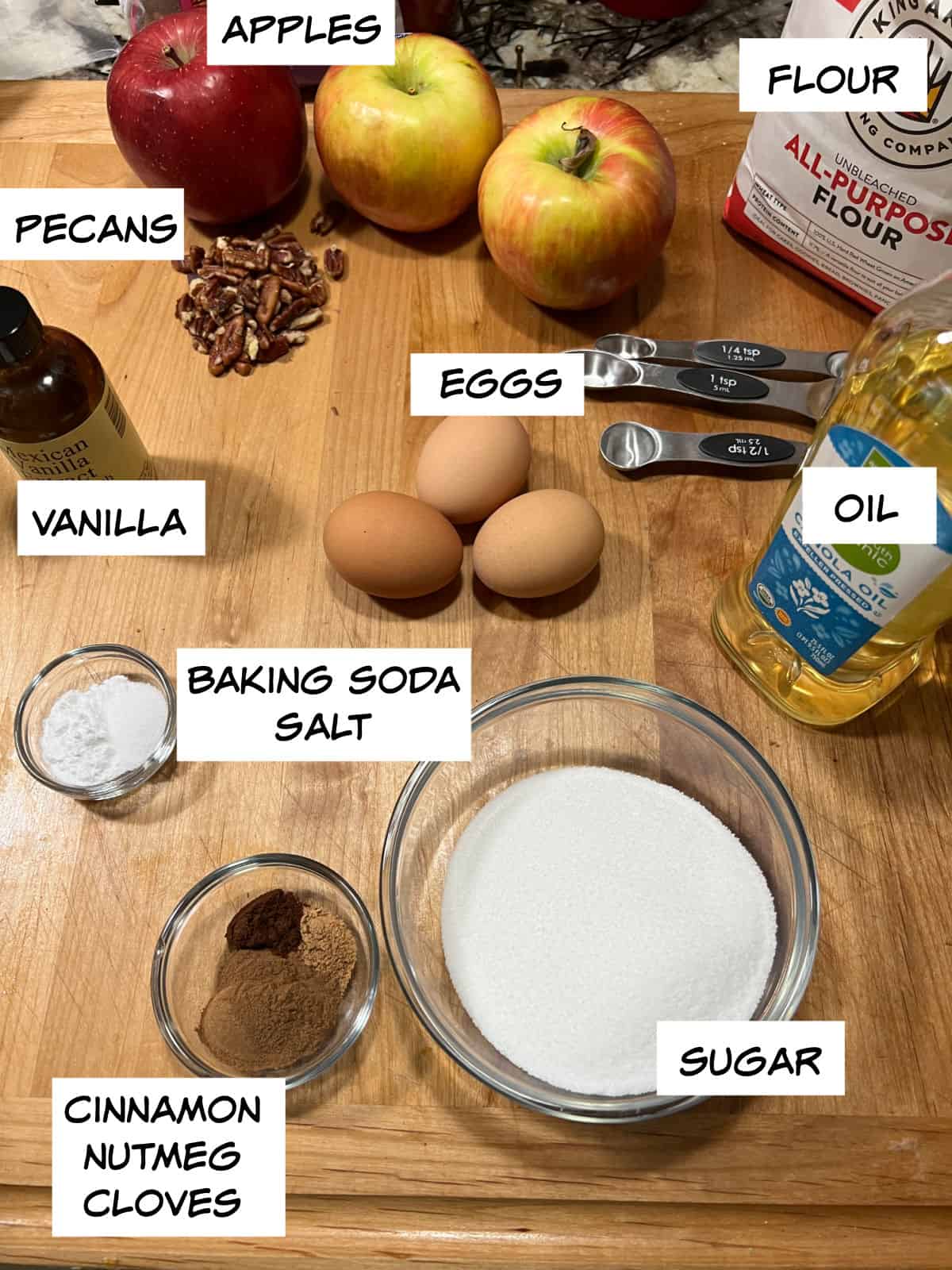 Ingredients: apples, pecans, flour, oil, eggs, sugar, vanilla, baking soda, salt, cinnamon, nutmeg, and cloves. 