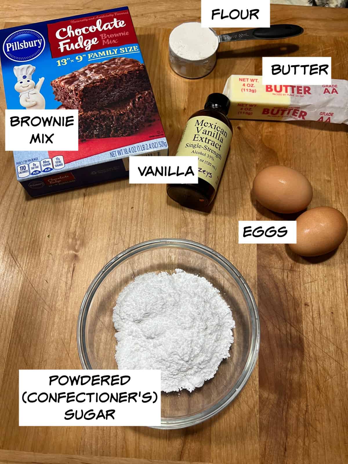 Ingredients: brownie mix, flour, butter, eggs, vanilla, and powdered sugar.