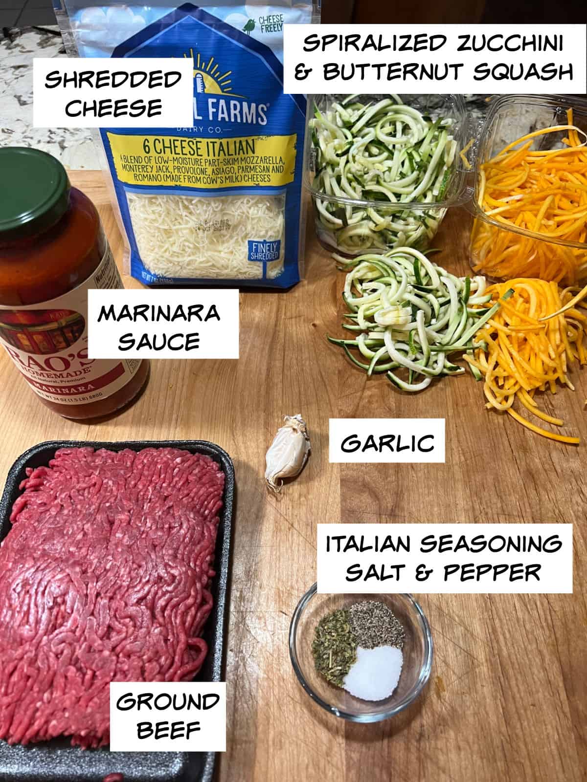 Ingredients: shredded cheese, spiralized squash, garlic, marinara sauce, ground beef, Italian seasoning, and salt and pepper.