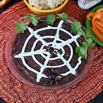 Spider web black bean dip for Halloween.