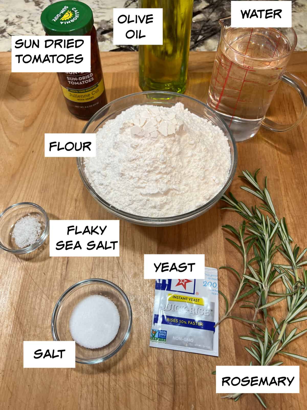 Ingredients: sun dried tomatoes, olive oil, water, flour, yeast, rosemary, salt, and flaky sea salt.