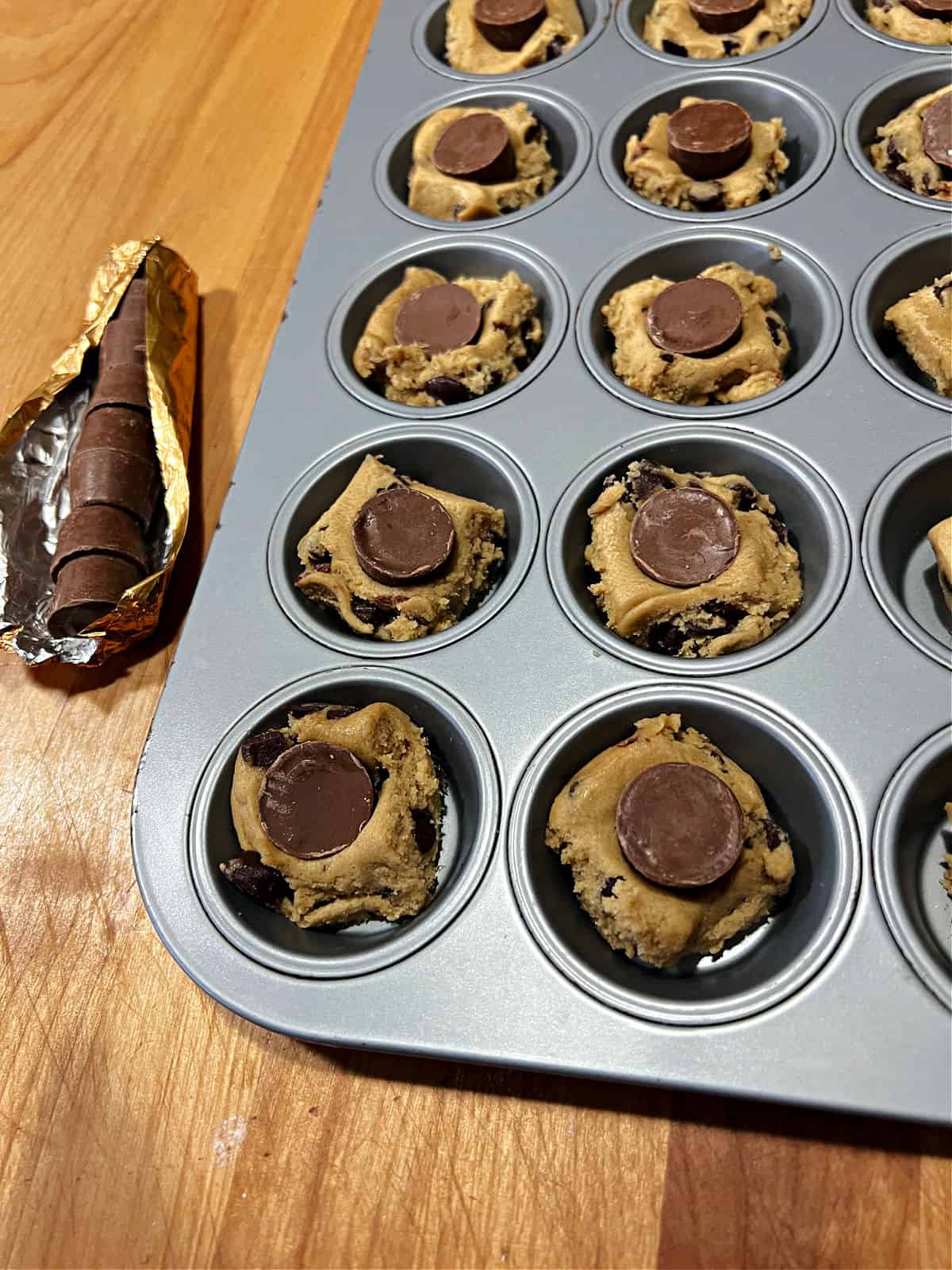 A piece of Rolo candy pressed into the cookie dough.