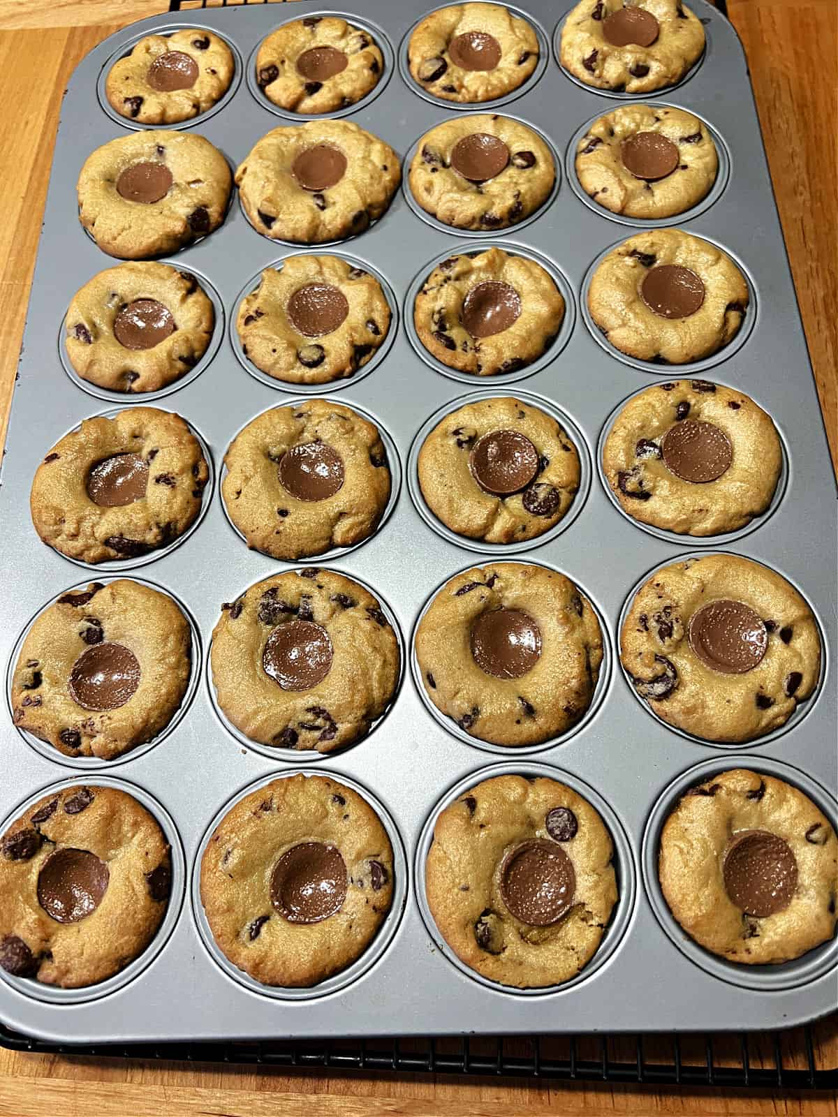 Baked cookies right out of the oven in the muffin pan.