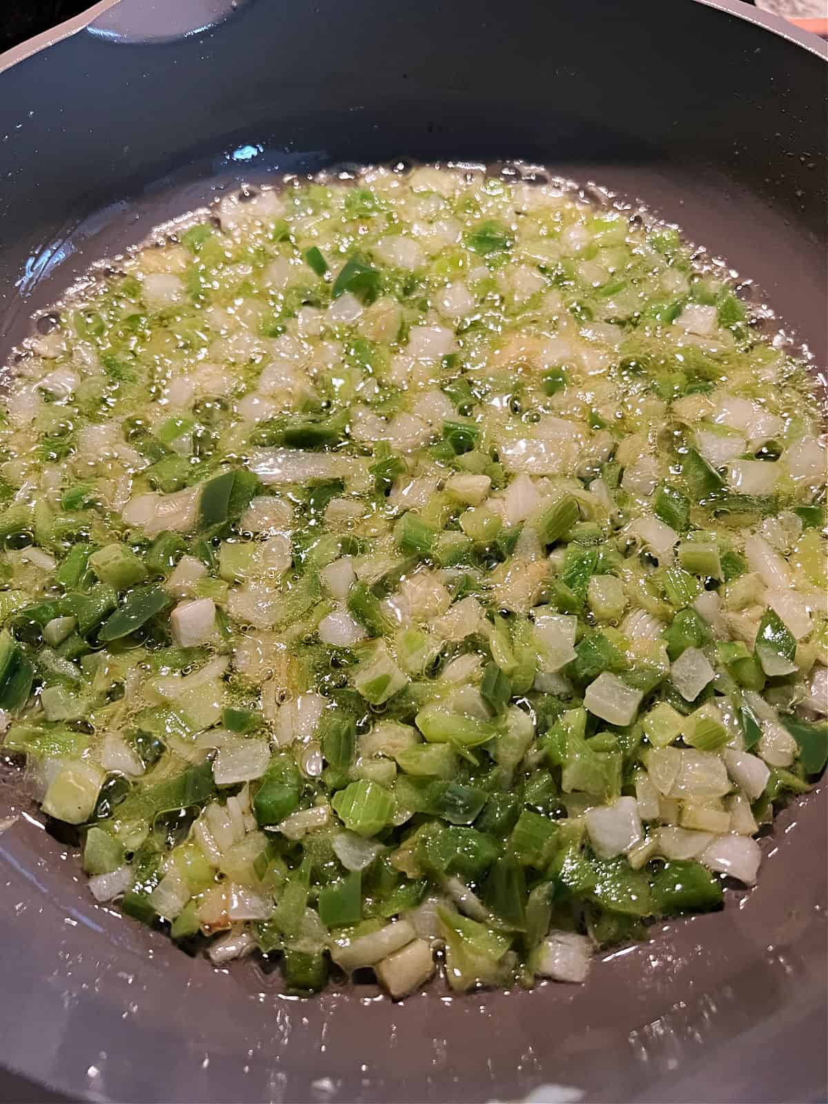 Vegetables cooking in the skillet.