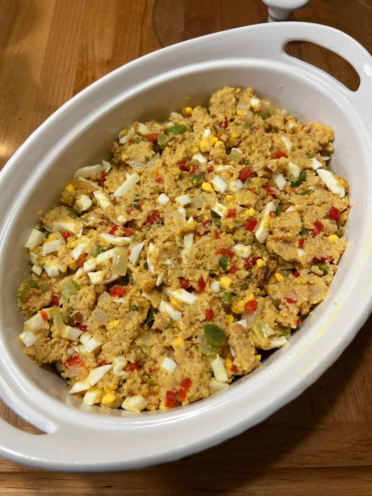 Dressing mixture transferred to an oval casserole dish.